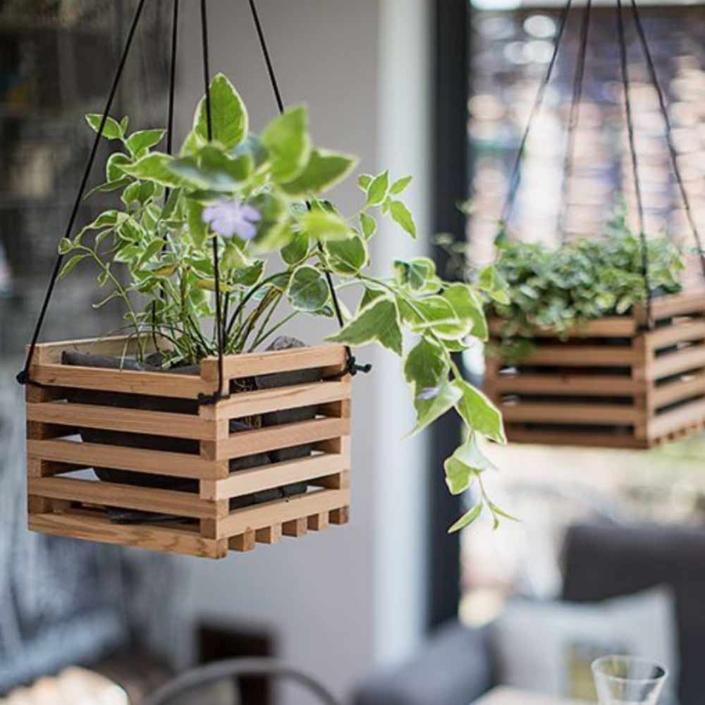 Image of hanging baskets used in a blog post about summer home decor ideas from For the Floor & More