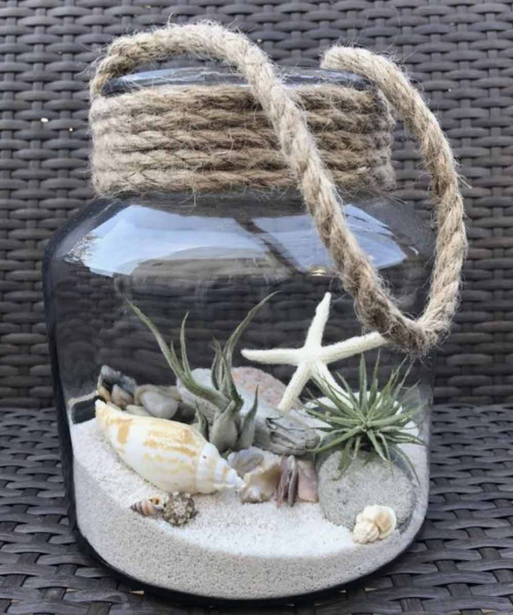 Image of a terrarium used in a blog post about summer home decor ideas from For the Floor & More