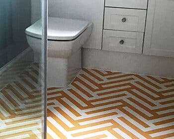 Herringbone Ochre flooring seen in a modern bathroom