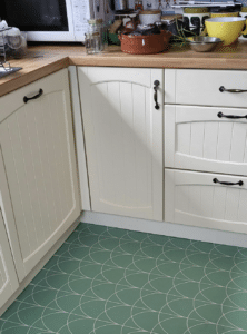 Galley kitchen with patterned vinyl floor