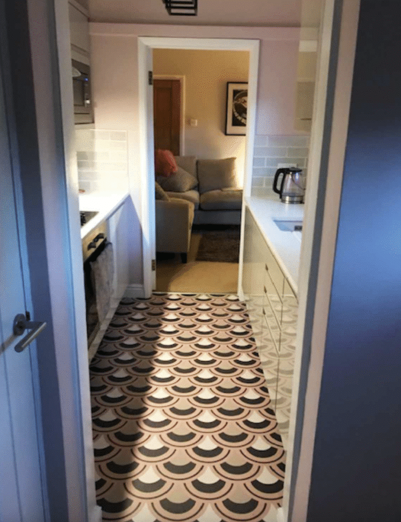 Arch pattern vinyl flooring from For the Floor & More used in a post about neutral kitchens.