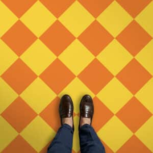 Bespoke tonal checkerboard vinyl flooring produced by For the Floor & More