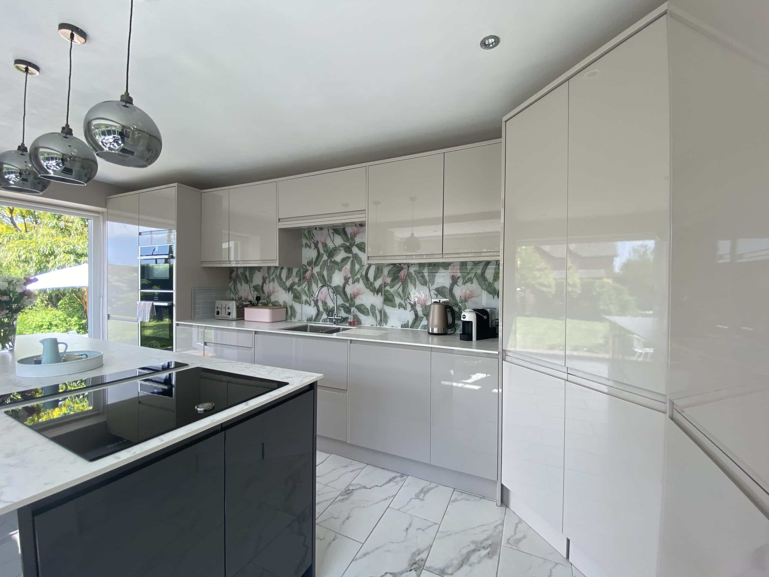 Glass splashback fitted in a kitchen, seen across the room