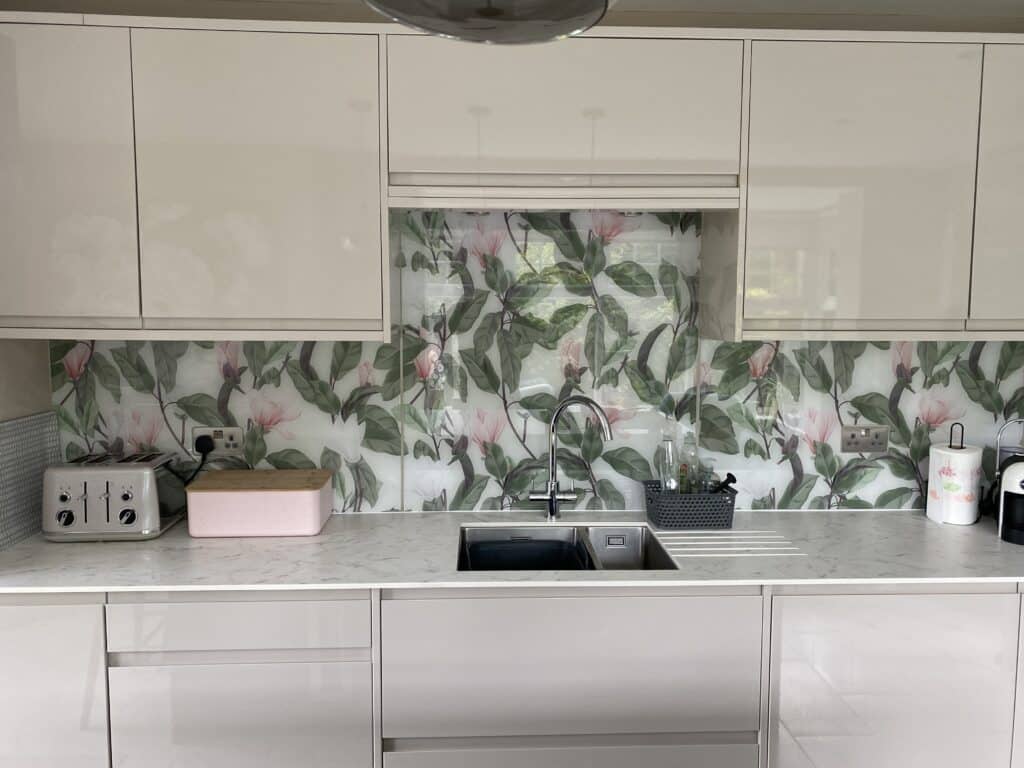 A custom three-panel splashback planned around sockets on a flat wall.