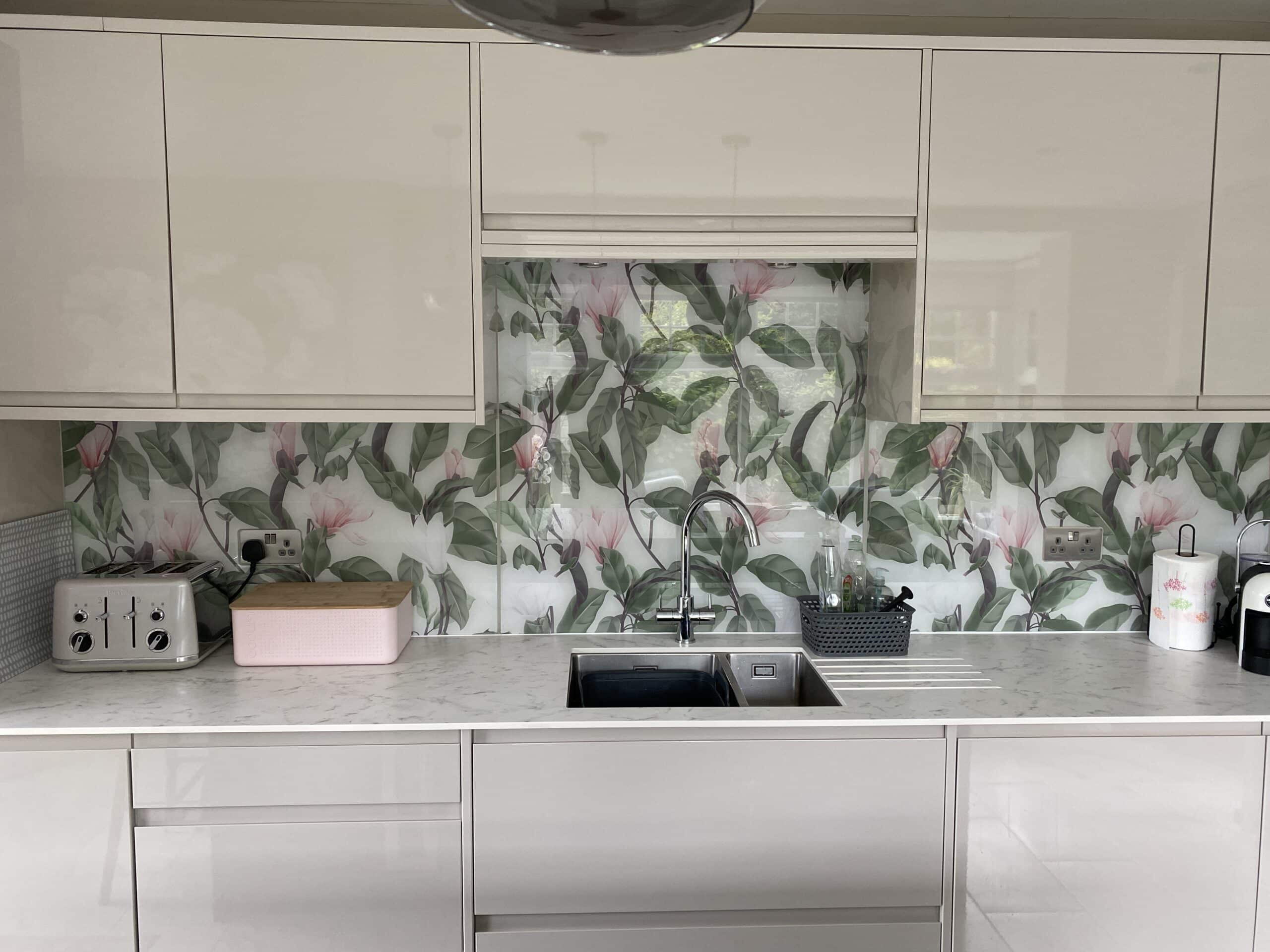 A custom three-panel splashback planned around sockets on a flat wall.